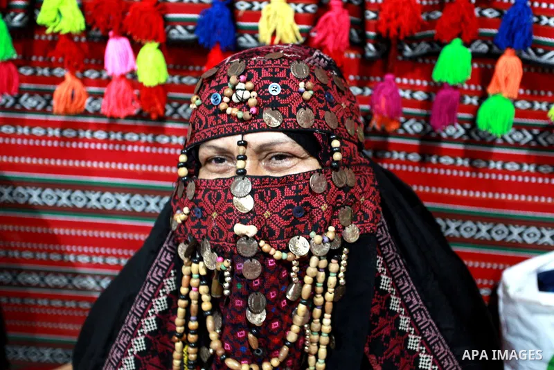 Palestinian Bedouin women weave the traditional products, wool ornaments and carpets, on the National Day of Palestinian Heritage, in Gaza city, on October 7, 2021. Palestinians enjoy a rich cultural heritage. The Palest...