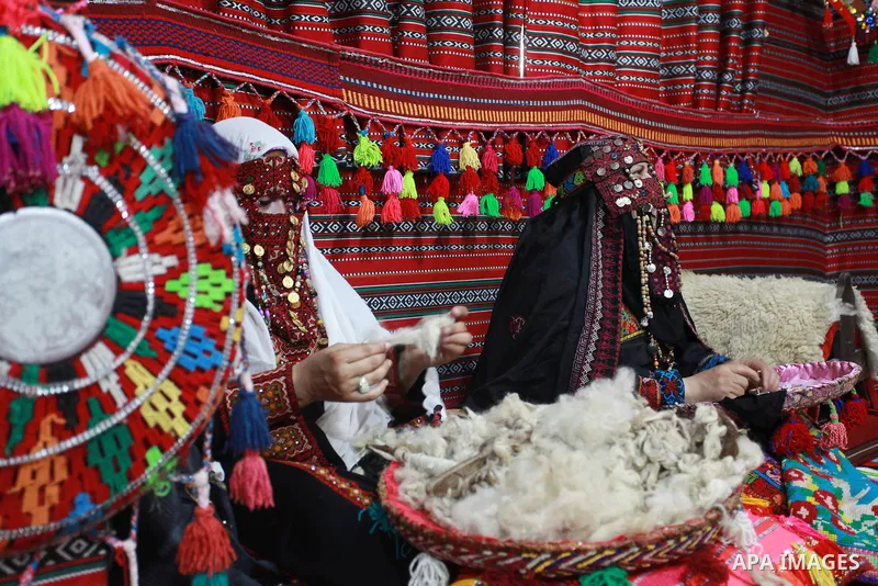 Palestinian Bedouin women weave the traditional products, wool ornaments and carpets, on the National Day of Palestinian Heritage, in Gaza city, on October 7, 2021. Palestinians enjoy a rich cultural heritage. The Palest...