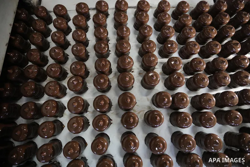 Palestinian workers prepare the vanilla candy known as "Ras El-abed or Shatawi" in the sweet factory , in Deir al-Balah, central Gaza Strip on October 7, 2021. “Ras el Abed” means “Head of Slave”. We would often laugh ab...