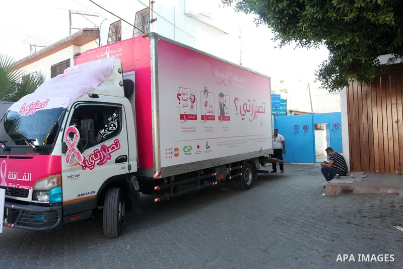 Palestinian women participate in the "Pink Caravan" campaign for early breast cancer screening, in Khan Younis in the southerm of Gaza strip, on October 9, 2021. Breast cancer is the No.1 cancer affecting women and early...
