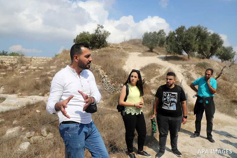 Palestinians visit the Roman basilica and forum in the village of Sebastia near the West Bank city of Nablus, on October 11, 2021.The ancient town of Sebastia is one of the greatest archaeological sites of the Holy Land,...