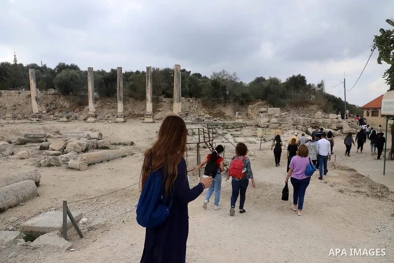 Palestinians visit the Roman basilica and forum in the village of Sebastia near the West Bank city of Nablus, on October 11, 2021.The ancient town of Sebastia is one of the greatest archaeological sites of the Holy Land,...