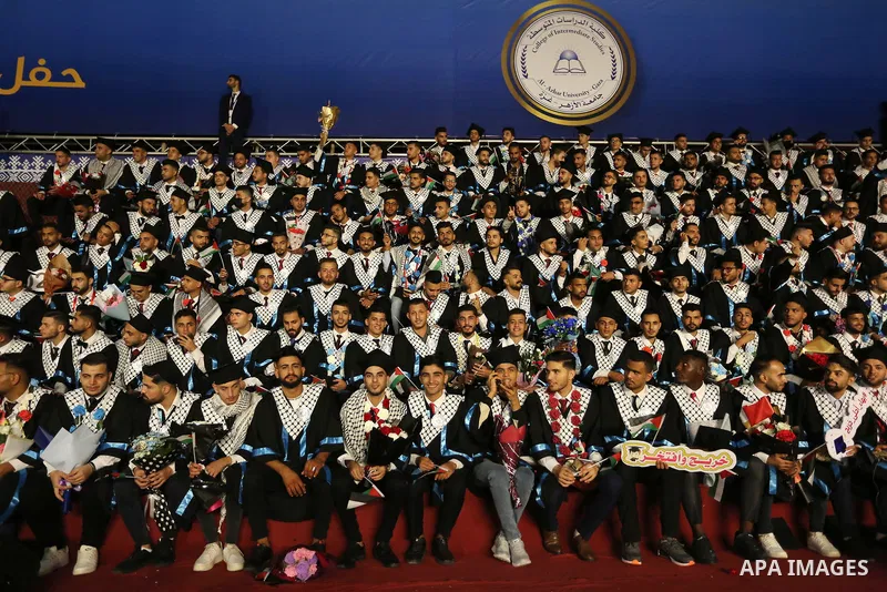 Palestinian students from al-Azhar University attend their graduation ceremony, in Gaza city on October 12, 2021. Photo by Ashraf Amra