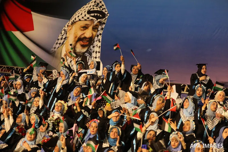 Palestinian students from al-Azhar University attend their graduation ceremony, in Gaza city on October 12, 2021. Photo by Ashraf Amra