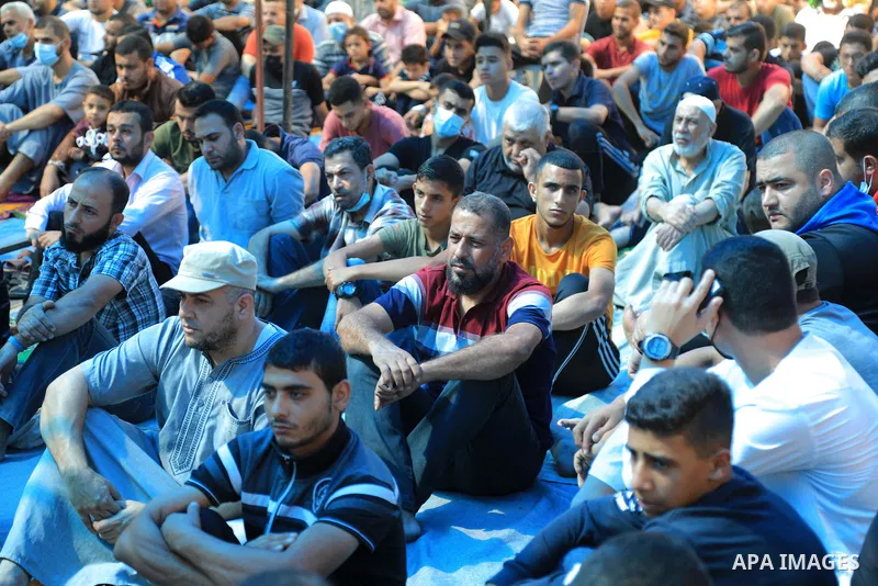 Palestinians attend Friday prayer in front of Red cross office in solidarity with prisoners on hunger strike held at Israeli Jails, in Gaza city on October 15, 2021. Photo by Dawoud Abo Alkas