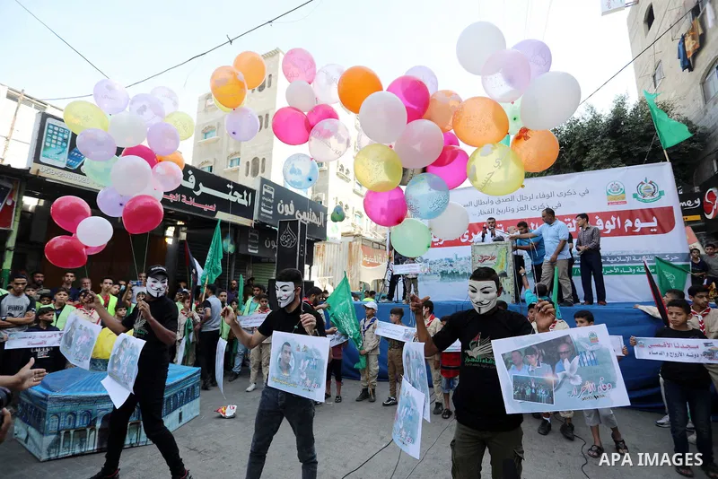 Palestinians take part in a rally ​on 10th anniversary of prisoners swap deal between Hamas and Israel, in Jabalia in the northern Gaza strip on October 15, 2021. October will mark a decade since the last major swap deal...