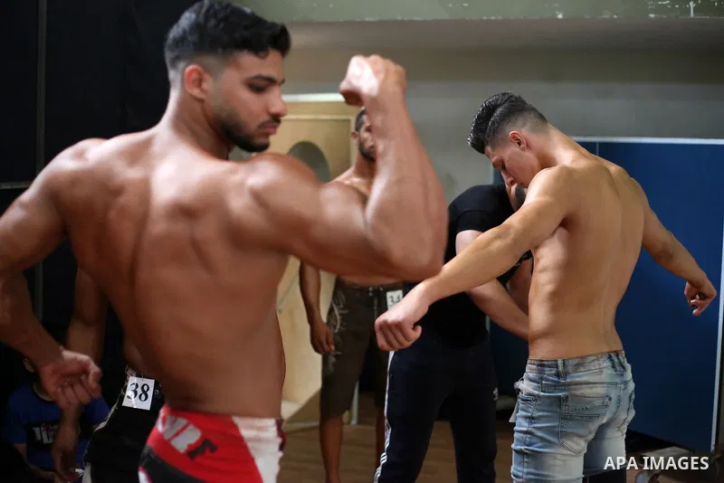 Palestinian bodybuilders take part in Physique and Bodybuilding competition organized by the Palestinian union of Bodybuilding and Fitness, in Gaza city on October 15, 2021. Photo by Ashraf Amra