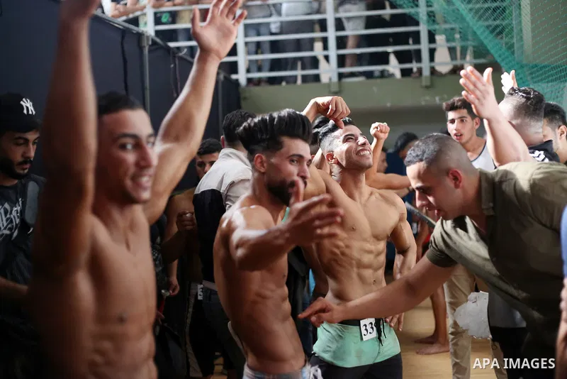 Palestinian bodybuilders take part in Physique and Bodybuilding competition organized by the Palestinian union of Bodybuilding and Fitness, in Gaza city on October 15, 2021. Photo by Ashraf Amra