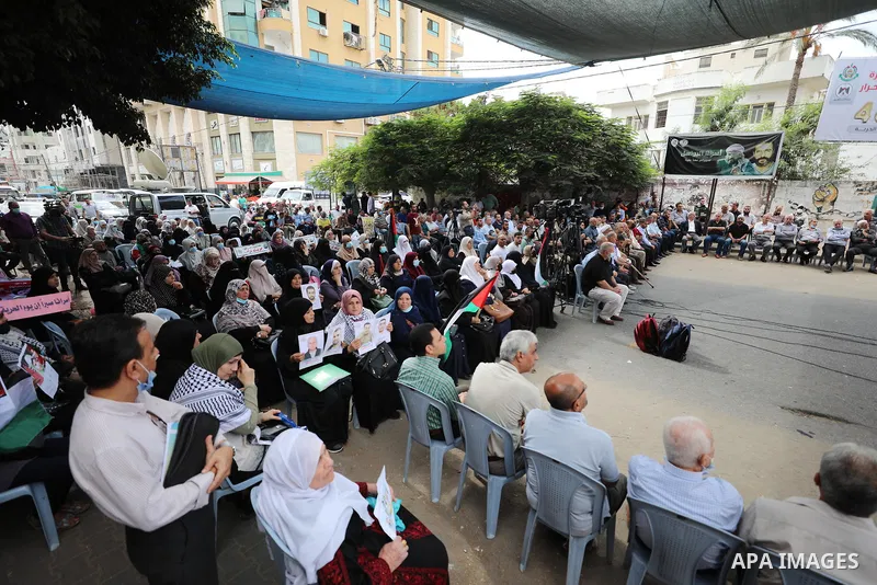 Palestinians take part in a rally ​on 10th anniversary of prisoners swap deal between Hamas and Israel, in front of Red cross office, in Gaza city on October 18, 2021. October will mark a decade since the last major swap...