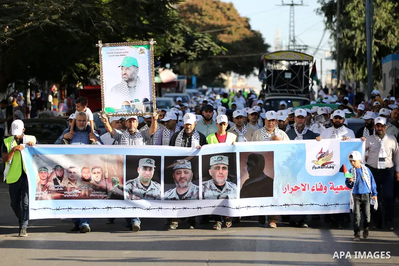 Palestinians take part in a march marking the 10th anniversary of prisoners swap deal between Hamas and Israel, in Gaza city on October 18, 2021. October will mark a decade since the last major swap deal between Israel a...