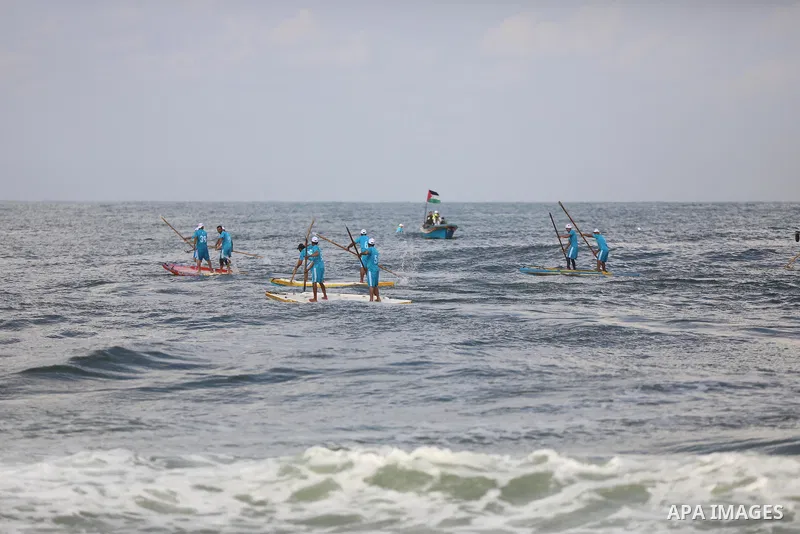 Palestinian players take part in the first sailing and rowing championship on the shore of the Mediterranean, in Gaza city, on Ocotber 20, 2021. The Palestinian Sailing and Rowing Federation organized the first sailing a...