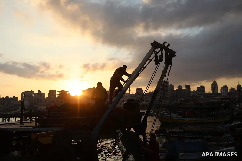 Palestinian fishermen sell fish at Gaza City's main port on October 21, 2021. Fishing is a major source of revenue for the impoverished Palestinian enclave. Israel, which maintains a blockade on Gaza strip, has over the...