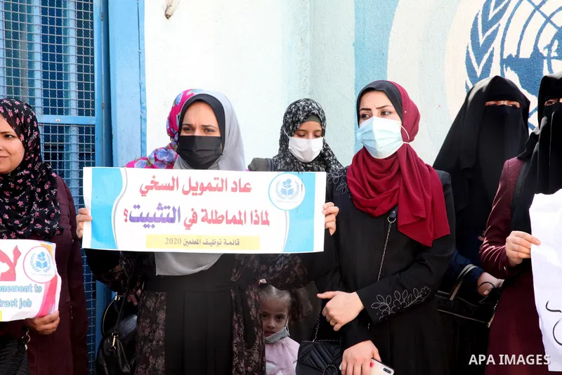 Palestinian teachers take part in a protest demanding their rights in front of the headquarters United Nations Relief and Works Agency (UNRWA), in Gaza City on October 21, 2021. UNRWA froze 250 contracts of the temporary...
