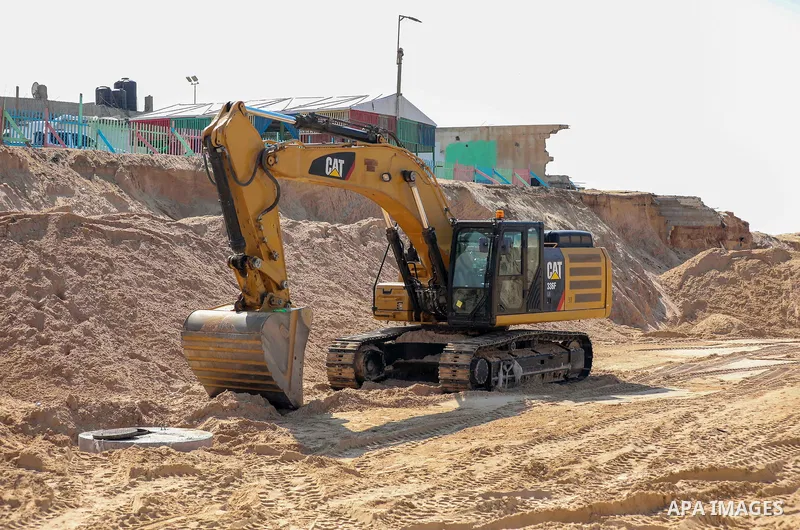 Egyptian workers and bulldozers sent from Egypt start rehabilitation al-Rasheed street in Gaza city, on October 21, 2021. Egyptian president abdel Fattah el-Sisi promised $500 million for rebuilding Gaza, and gave direct...