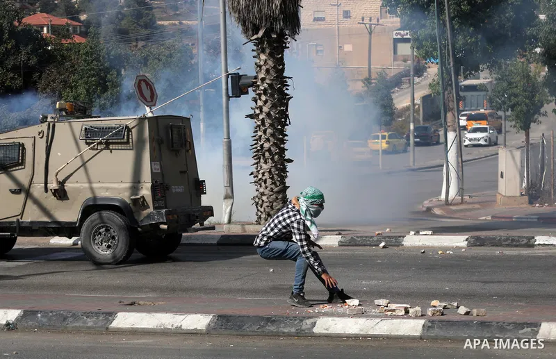 Palestinian protesters clash with Israeli forces following a demonstration calling for the release of Palestinian prisoners on hunger strike in Israeli jails, in the West Bank city of Hebron on October 24, 2021. Seven Pa...