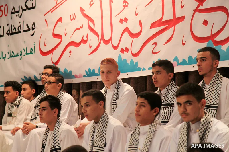 Palestinian children participate in a ceremony to honor the memorizers of the Holy Koran, in Gaza city on October 25, 2021. Photo by Omar Ashtawy