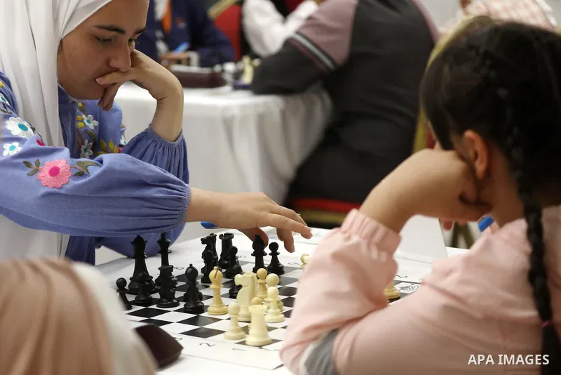 Palestinian girls play chess during Palestinian Chess Championship for Women 2021, which organized by Palestinian Chess Federation, in the West Bank city of Hebron on October 30, 2021. Photo by Mamoun Wazwaz