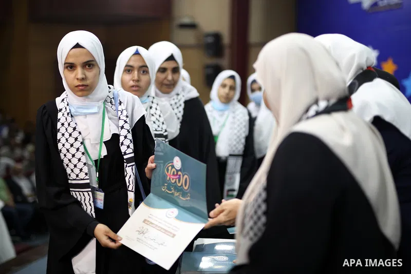 Palestinians participate in a ceremony to honor more than of 500 of memorizers of the Holy Koran, in Islamic Unversity of Gaza (IUG) in Gaza city on October 31, 2021. Photo by APA