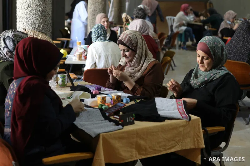 Palestinian women display thier handmade during an exhibition inside Rashad Shawa Cultural Center, in Gaza city on November 1, 2021. Photo by Majdi Fathi