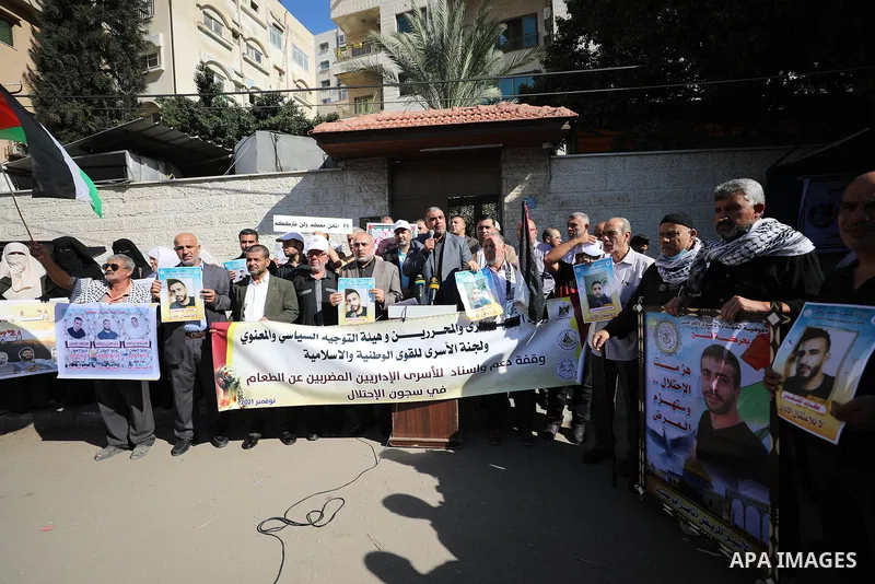 Palestinians take part in a protest in solidarity with prisoners on hunger strike at Israeli jails, in front of Red Cross office in Gaza city on November 8, 2021. Thousands of Palestinian political prisoners in Israeli p...