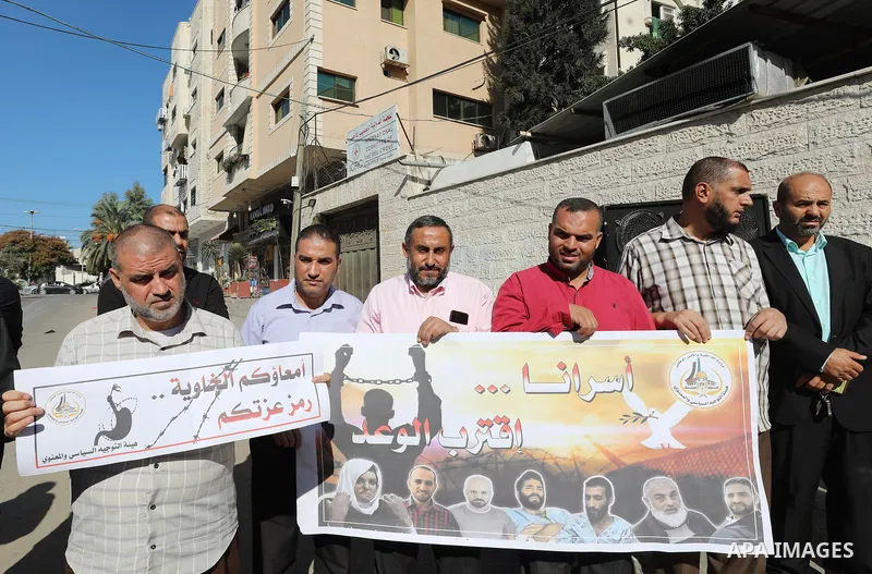 Palestinians take part in a protest in solidarity with prisoners on hunger strike at Israeli jails, in front of Red Cross office in Gaza city on November 8, 2021. Thousands of Palestinian political prisoners in Israeli p...