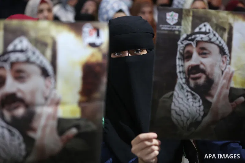 Palestinians take part in a ceremony to mark the 17th anniversary of death of late president Yasser Arafat, in Gaza city on November 11, 2021. Photo by Ashraf Amra