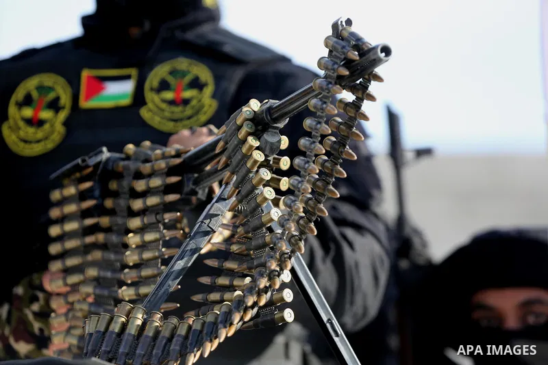 Palestinian militants from the Al-Quds Brigades, the armed wing of the Islamic Jihad movement, take part in a military parade to mark the seconed anniversary of killed of Islamic Jihad commander, Bahaa Abu el-Atta, in Ga...