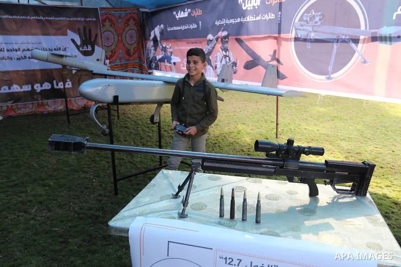 Palestinians attend the military and historical exhibition to mark the nine anniversary of Ahmed al-Jabari death, the late leader of Ezzedine al-Qassam Brigades, the armed wing of the Palestinian Hamas movement in Gaza C...
