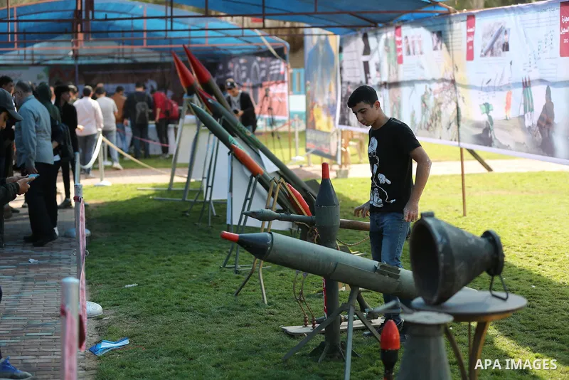 Palestinians attend the military and historical exhibition to mark the nine anniversary of Ahmed al-Jabari death, the late leader of Ezzedine al-Qassam Brigades, the armed wing of the Palestinian Hamas movement in Gaza C...