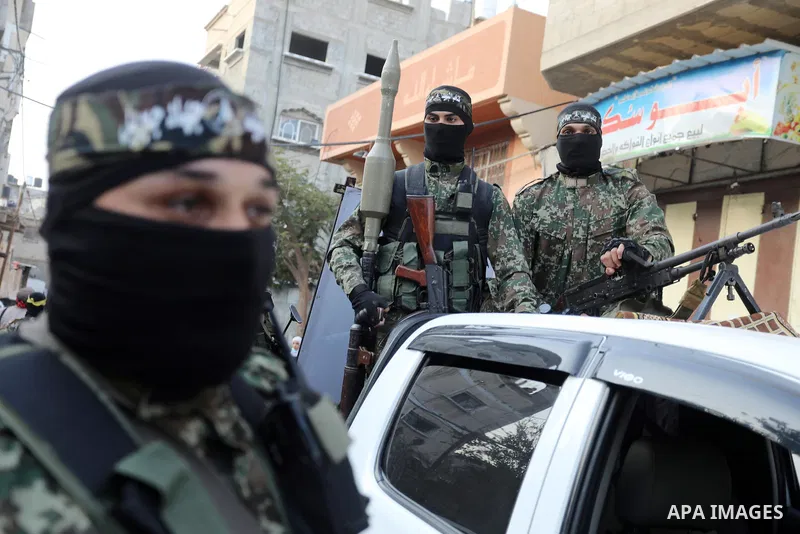 Members of Palestinian factions military wings, takes part in a parade in Gaza City on November 14, 2021. Photo by Ashraf Amra