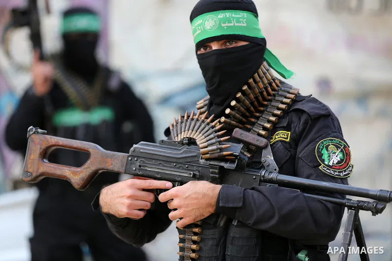 Members of Ezzedine al-Qassam Brigades, military wing of the Palestinian Hamas movement, takes part in a parade in Gaza City on November 14, 2021. Photo by Ashraf Amra