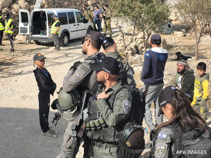 Israeli security forces confiscate barracks in the Palestinians residential area after Israeli authorities said it was built without a permit in Yatta south of Hebron in the occupied West Bank, on November 15, 2021. Acco...