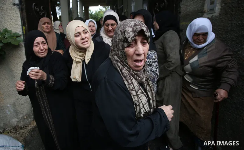 Palestinians carry the body of Isra Ekhzemiya during her funeral at Qabatya village near the West Bank City of Jenin, 20 November 2021. According to medical sources, Isra was killed on 30 September by Israeli soldiers af...