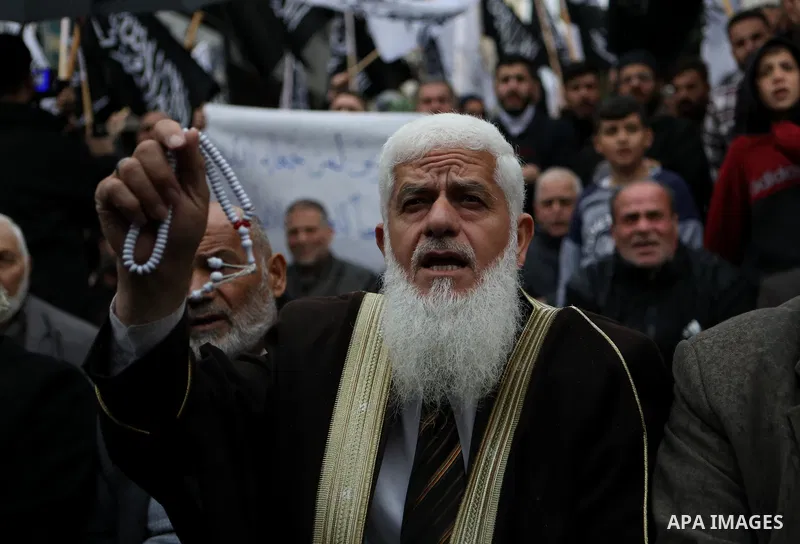 Palestinian supporters of Hizb ut-Tahrir or the Islamic Liberation Party of the Islamic Liberation Party take part in a protest against recent family quarrels in the West Bank town of Hebron, on November 20, 2021. Hebron...