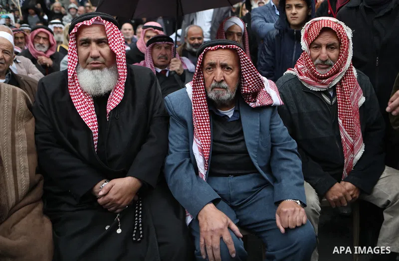 Palestinian supporters of Hizb ut-Tahrir or the Islamic Liberation Party of the Islamic Liberation Party take part in a protest against recent family quarrels in the West Bank town of Hebron, on November 20, 2021. Hebron...