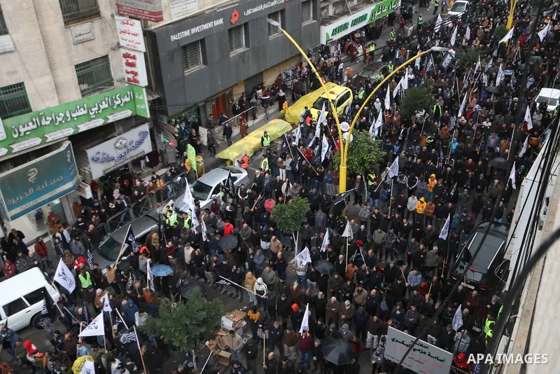 Palestinian supporters of Hizb ut-Tahrir or the Islamic Liberation Party of the Islamic Liberation Party take part in a protest against recent family quarrels in the West Bank town of Hebron, on November 20, 2021. Hebron...