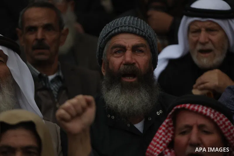 Palestinian supporters of Hizb ut-Tahrir or the Islamic Liberation Party of the Islamic Liberation Party take part in a protest against recent family quarrels in the West Bank town of Hebron, on November 20, 2021. Hebron...