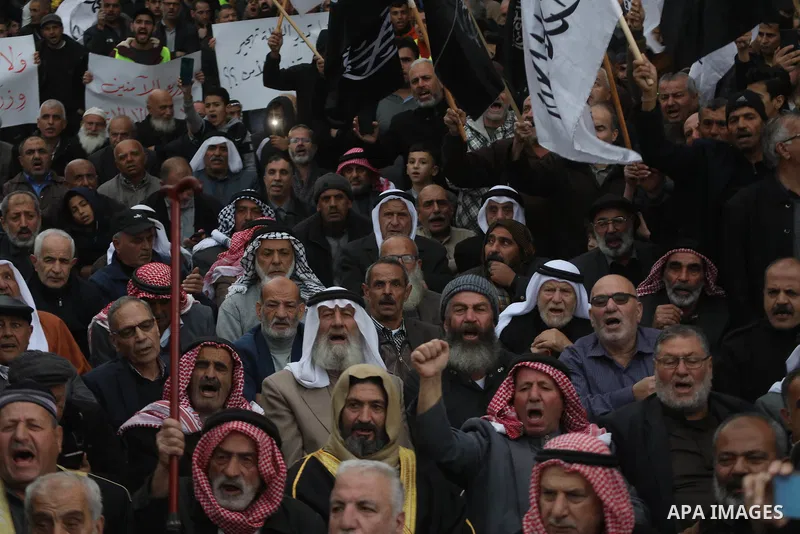 Palestinian supporters of Hizb ut-Tahrir or the Islamic Liberation Party of the Islamic Liberation Party take part in a protest against recent family quarrels in the West Bank town of Hebron, on November 20, 2021. Hebron...