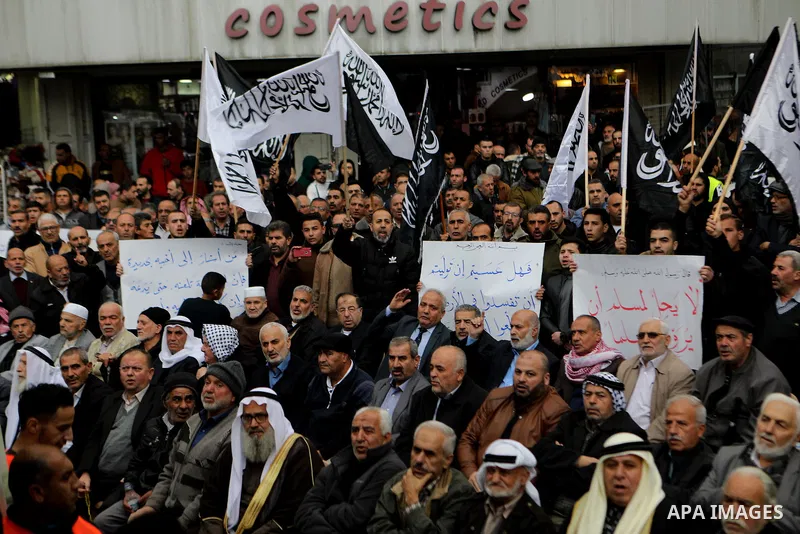 Palestinian supporters of Hizb ut-Tahrir or the Islamic Liberation Party of the Islamic Liberation Party take part in a protest against recent family quarrels in the West Bank town of Hebron, on November 20, 2021. Hebron...