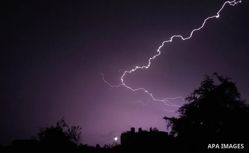 Lightning strikes is seen in the sky over Gaza city during a rainstorm on November 20, 2021. Photo by Ashraf Amra