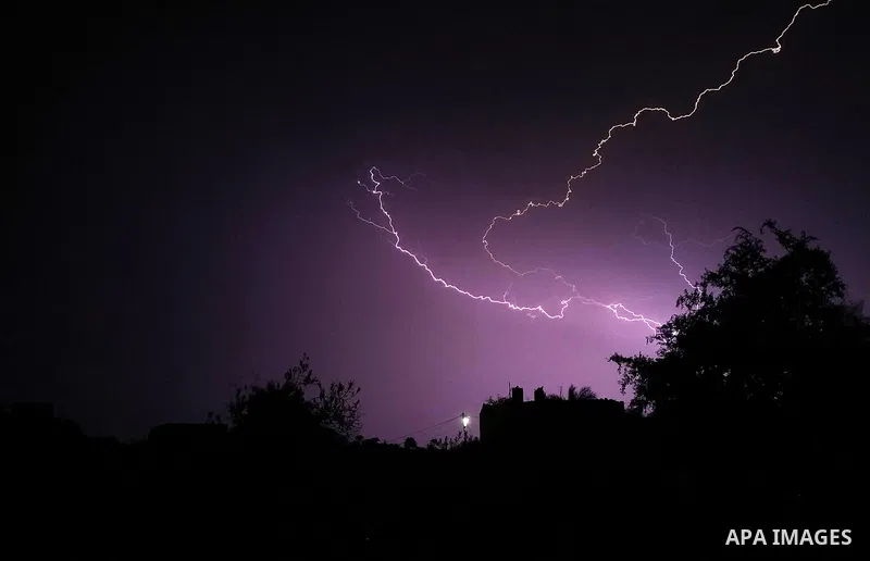 Lightning strikes is seen in the sky over Gaza city during a rainstorm on November 20, 2021. Photo by Ashraf Amra