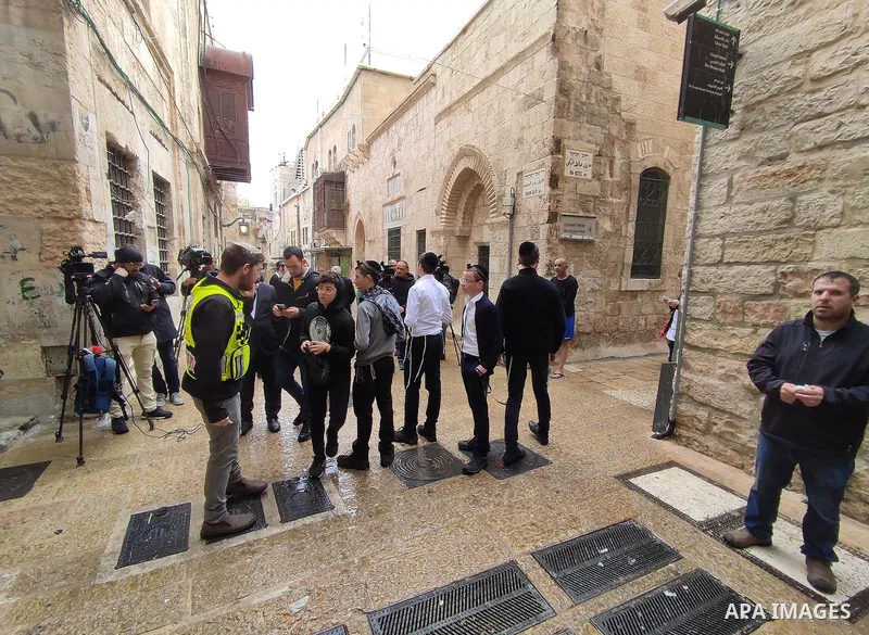 Israeli border guards stand guard behind a security perimeter at the scene of a shooting in the old city of Jerusalem on November 21, 2021. At least four people were wounded early on November 21, including two seriously,...
