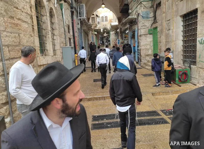 Israeli border guards stand guard behind a security perimeter at the scene of a shooting in the old city of Jerusalem on November 21, 2021. At least four people were wounded early on November 21, including two seriously,...