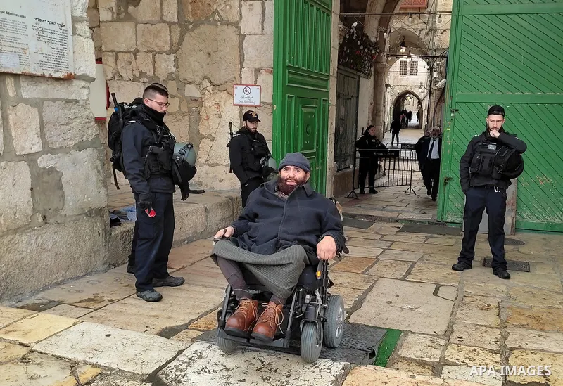 Israeli border guards stand guard behind a security perimeter at the scene of a shooting in the old city of Jerusalem on November 21, 2021. At least four people were wounded early on November 21, including two seriously,...