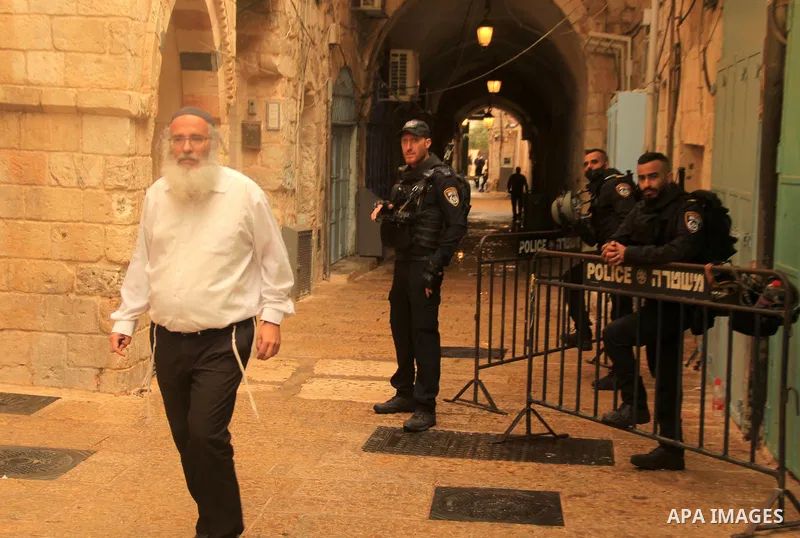 Israeli border guards stand guard behind a security perimeter at the scene of a shooting in the old city of Jerusalem on November 21, 2021. At least four people were wounded early on November 21, including two seriously,...