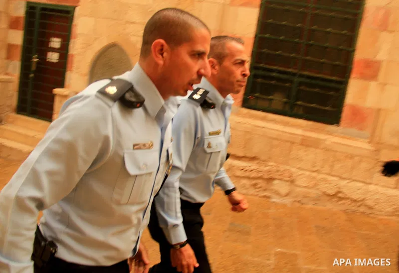 Israeli border guards stand guard behind a security perimeter at the scene of a shooting in the old city of Jerusalem on November 21, 2021. At least four people were wounded early on November 21, including two seriously,...