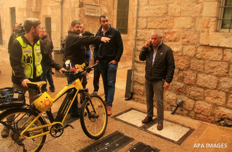 Israeli border guards stand guard behind a security perimeter at the scene of a shooting in the old city of Jerusalem on November 21, 2021. At least four people were wounded early on November 21, including two seriously,...
