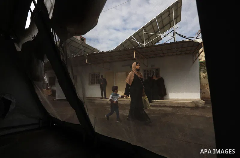 Palestinians get inoculated with a dose of the Covishield vaccine against the Covid-19 coronavirus, at a temporary vaccination centre set up, in Deir al-Balah in the center of Gaza Strip on November 211, 2021. Minister o...