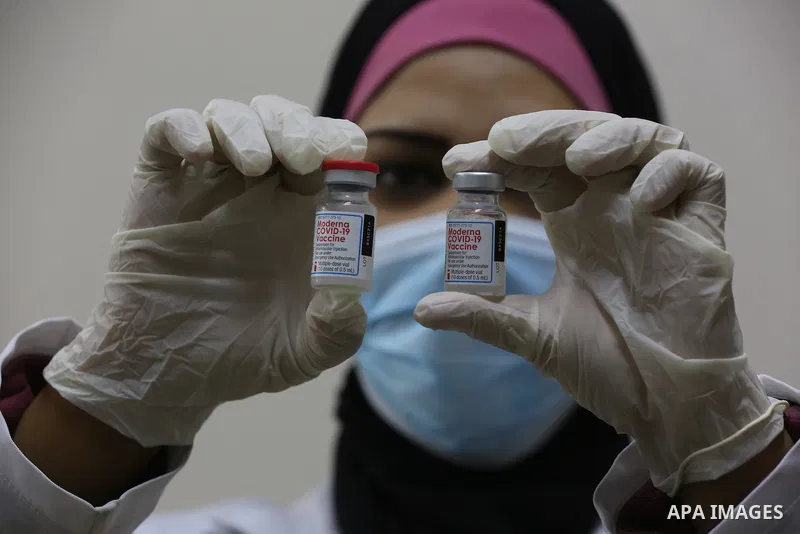 Palestinians get inoculated with a dose of the Covishield vaccine against the Covid-19 coronavirus, at a temporary vaccination centre set up, in Deir al-Balah in the center of Gaza Strip on November 211, 2021. Minister o...