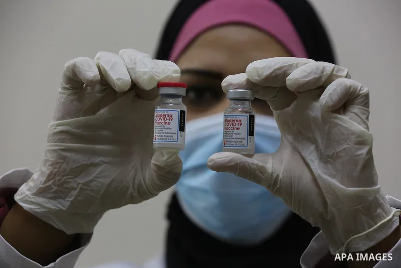 Palestinians get inoculated with a dose of the Covishield vaccine against the Covid-19 coronavirus, at a temporary vaccination centre set up, in Deir al-Balah in the center of Gaza Strip on November 211, 2021. Minister o...